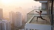 © Sup - Woman practicing yoga on a balcony overlooking a cityscape during sunrise