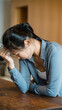 © Bastien - Distressed woman crying at table suffering from stress anxiety and heartbreak