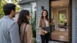 © Shōna - Real Estate Agent Welcoming Couple During Home Tour and Property Viewing at Modern House Entrance