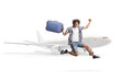 © Ljupco Smokovski - Happy male traveler jumping with a suitcase in front of a plane
