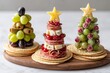 © Olsek - Festive and Delicious Holiday Snack Towers Made of Fruits and Meats Arranged like Christmas Trees on a Wooden Platter Perfect for Celebrations. Generative AI