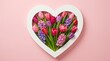 © DailyLens Studio - Spring flower bouquet in a heart shaped frame expressing love and gratitude on pink background.
