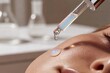© Dmitrii - Woman receiving facial serum treatment from professional dropper. Skincare procedure for hormonal balance and skin health. Anti-aging cosmetic therapy for glowing hydrated skin.