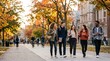 © Nina - Diverse group of college students walking together on university campus path during autumn semester, happy young adults talking and laughing outdoors