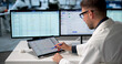 © Andrey Popov - Man Using Laptop To Review Medical Billing Claims
