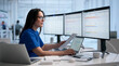 © Andrey Popov - Woman Healthcare IT Specialist Reviews Patient Data