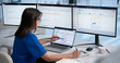 © Andrey Popov - Woman Reviews Patient Billing Details On Laptop