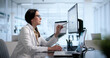 © Andrey Popov - Healthcare Manager Using Laptop