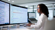 © Andrey Popov - Young Healthcare IT Specialist Updates Patient Records