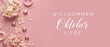 © Dinali - Willkommen Oktober Liebe German text on pink autumn banner background with dried hydrangea flowers, decorative ribbon, origami stars, romantic fall layout, and flatlay seasonal card greeting.