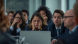 © demzp - Business professionals looking stressed and overwhelmed during a meeting