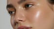 © Viktor - Close-up of a young woman face with dewy, glowing skin. Her complexion is smooth, hydrated, and radiant, showing subtle texture. Perfect for beauty and skincare advertising.