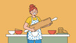 © Faiza - Smiling young woman wearing a polka dot apron holds a giant wooden rolling pin next to a kitchen counter with cookies.