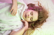 © Volodymyr - Kid sleep calm on bedtime. Child sleeping with soft pillow. Kid sleep and dreaming quietly. Child sleeping tender moment. Kid sleep face close up. Child sleeping peacefully at home bed.