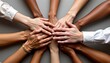 © MakeitEasy - The image shows a group of diverse hands stacked together in the center, symbolizing unity and teamwork