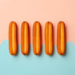 © Pixel-Shot - Five traditional spanish churros dessert arranged in a row on a pastel pink and blue background, sweet food concept, this sweet fried dough pastry is a popular snack and treat
