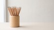 © Marina P. - Wooden pencil holder with sharpened pencils on light surface