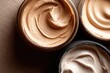 © SilentSmog - High angle close up of various cosmetic makeup foundation cream shades in jars with cosmetics foundation skincare containers products complexion moisturizer treatment cosmetic collection