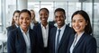 © Konstantin - Diverse business team smiling at camera, showing professionalism and teamwork in a modern office workplace setting