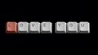 © Amena - Keyboard keys spelling Love You. Computer buttons forming a romantic message on black.