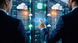 © remake - Business professionals analyze server and cloud database network infrastructure inside a modern data center. Digital storage, computing technology, and secure information transfer support enterprise