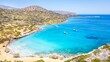 © JEROME LABOUYRIE - Kolokithia Beach near Elounda in Crete is a hidden paradise with crystal-clear turquoise waters, rocky coves, and peaceful Mediterranean scenery, perfect for a relaxing escape.