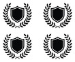 © Sagor - Cuatro escudos negros rodeados de coronas de laurel sobre fondo blanco
