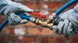 © Raza - Industrial worker connecting high pressure air hose with metal quick coupling