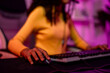 © Kawee - Close up of African American teenage girl playing online video game on computer.