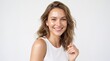 © abuzar - Young woman smiling confidently with hand on chest. Happy female professional showing self-assurance and positivity in studio portrait.