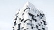© Stock - Modern geometric high-rise apartment building with a unique modular white facade design featuring stacked architectural elements against a clear sky