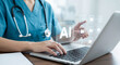© khmelev - Healthcare professional using artificial intelligence on a laptop for medical data management and analysis