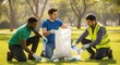 © mdthasinhasan - Diverse volunteers cleaning up park. Group of people collecting trash in a public area.