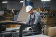 © Serhii - Carpenter operating cnc machine in furniture factory