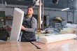 © Serhii - Worker handling foam in furniture factory production