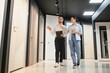 © Serhii - Shop assistant showing doors to customer in hardware store