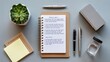 © PAVEL - A well-organized desk flat lay featuring a notepad with meeting notes, two pens, and a succulent plant.