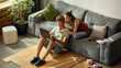 © Lustre Art Group  - Young couple browsing renovation products online on laptop. Concept of digital home improvement shopping and shared purchase decisions in e-commerce, furniture and flooring retail campaigns.