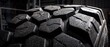 © Mino - Heavy duty tire tread close up showing rugged hexagonal rubber blocks designed for off road vehicles and extreme terrain performance and durability