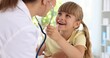 © New Africa - Doctor checking child with stethoscope in hospital, closeup