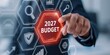 © Arfa_Media - Budget 2027 finance planning and corporate strategy on a digital technology screen