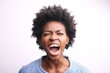 © Cavan Images - Frustrated young Black woman screaming loudly