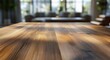 © Hal - sunlit wooden table surface in foreground with blurred cozy living room, sofa and cushions by large windows and indoor plants, warm inviting calm atmosphere