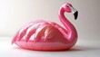 © kong - Glossy pink inflatable flamingo pool float on a neutral studio background, playful and cheerful summer vibe