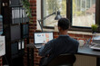 © DC Studio - Financial assistant planning ecommerce project on laptop working to create commercial investment for development in a startup office, working with laptop, charts and paperwork for financial.
