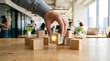 © Hajera - Businessman hand choosing wooden cube with idea light bulb and target icon.