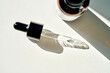 © Marevgenna - Pipette applying serum on white background with bottle