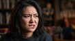 © 若石歌人 - 怒りと葛藤を抱える若いアジア人女性の表情クローズアップ
