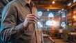 © ismail - Workplace safety compliance concept, industrial worker pointing stylus at digital panel with helmet shield bandage coin handshake gear and document icons, occupational health and insurance