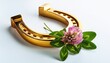 © Arturoo - Golden Horseshoe With Clover On A White Background